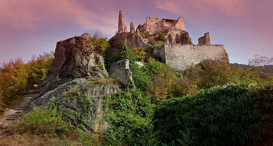 castle on top of mountain during daytime thumbnail