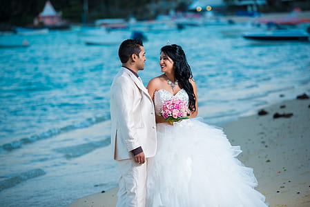 bride and groom on seashore thumbnail