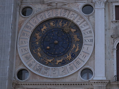 round brown and black concrete tower with clock thumbnail