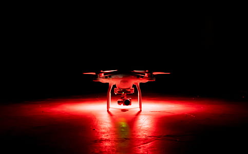 white quadcopter drone on surface thumbnail