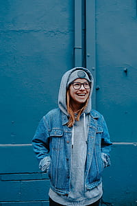 woman smiling wearing blue denim jacket with hoodie thumbnail