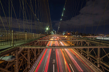 time lapse photography of cars on bridge during night time thumbnail