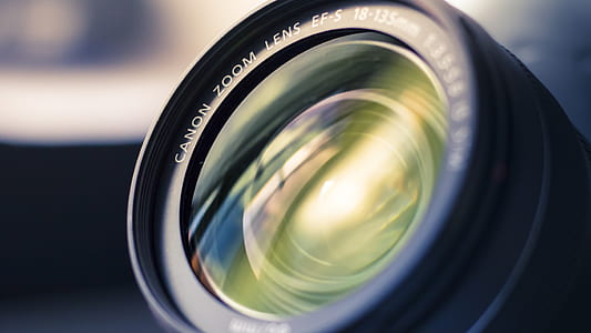 selective focus photography of black Canon telephoto lens thumbnail