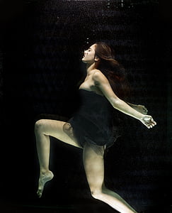 woman wears black tube dress underwater thumbnail