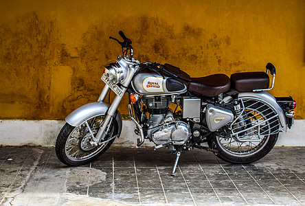 gray, black, and brown standard motorcycle parked beside of brown wall thumbnail
