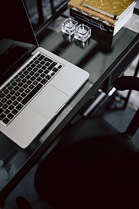 Organized desk with laptop and journals thumbnail