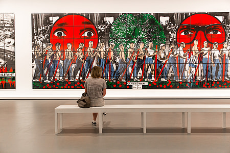 A woman sits in a modern art gallery in Paris, France thumbnail