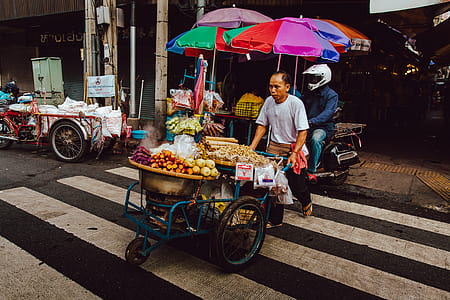 photo of man pushing cart with full of vegetables thumbnail