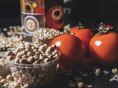Brown Nut Lot Beside Orange Tomatoes thumbnail