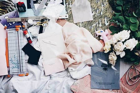 white textiles and white rose thumbnail