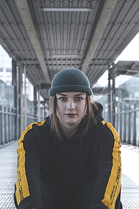 woman sitting on metal bridge thumbnail