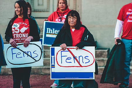 Women Holding Signage thumbnail