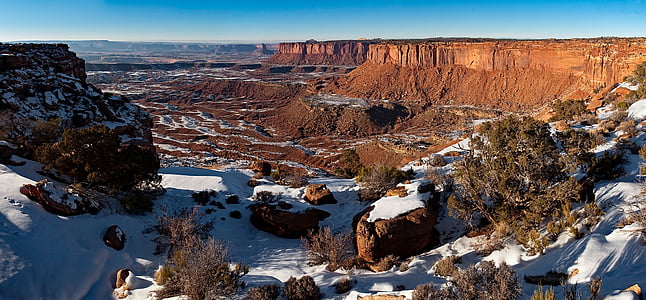 brown mountains covered with snow at daytime thumbnail