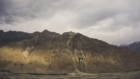 gray and brown mountain under white sky thumbnail