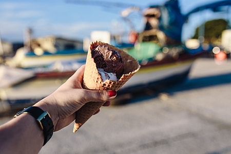 Man and Woman Holding Ice Creams thumbnail