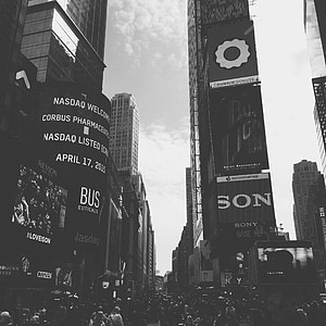grayscale photo of building under cloudy sky thumbnail