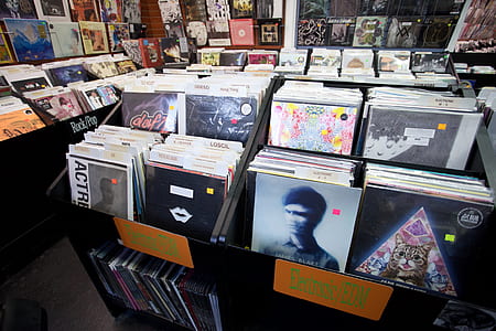 displayed vinyl sleeve on wooden shelf thumbnail