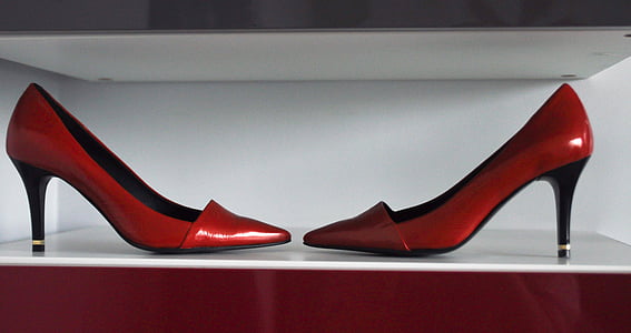 pair of red-and-black leather pointed-toe pump heeled sandals on white wooden table thumbnail