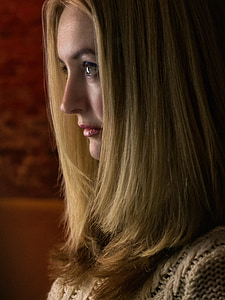 woman with blonde hair wearing white knitted top thumbnail