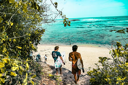 Two Man Holding Surfboards Going to Beach thumbnail