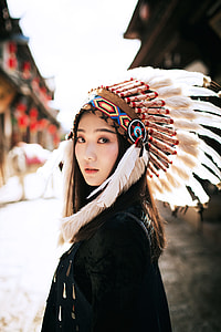 woman wearing Native American headdress thumbnail