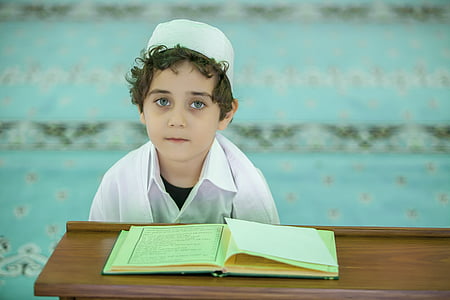 boy wearing white taqiyah thumbnail