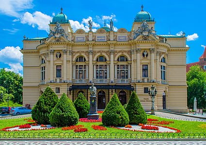 beige and blue mansion with trees landmark thumbnail
