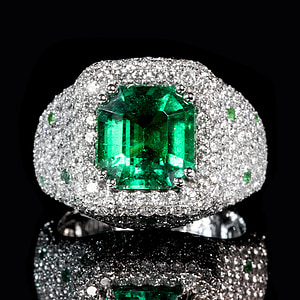 jeweled silver-colored ring on black surface thumbnail