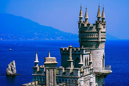 gray castle near sea at daytime thumbnail