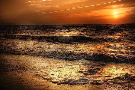beach and sea waves during sunset thumbnail