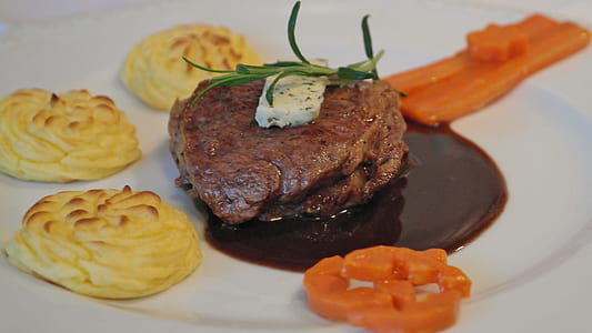 shallow focus photography of steak and carrots thumbnail