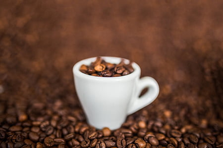 white teacup with coffee beans thumbnail