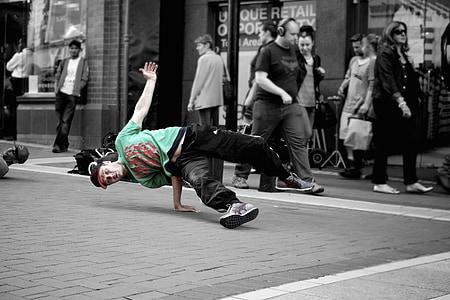 selective color photo of man in green and red t-shirt thumbnail
