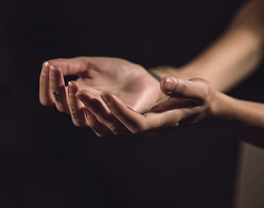 selective focus photo of human hands thumbnail