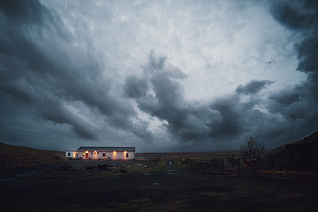 house under gray clouds thumbnail