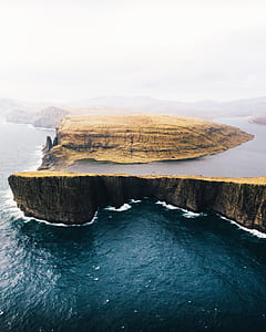 body of water surrounded by rock formation screenshot thumbnail