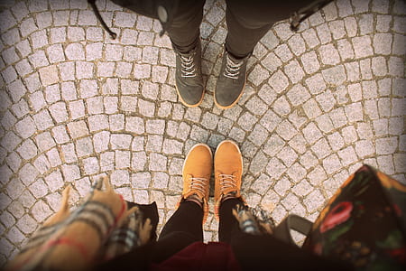 person wearing orange low-top sneakers thumbnail
