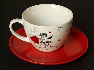 white and black cherub printed ceramic cup with red saucer thumbnail