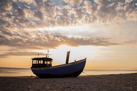 ferry at seashore under clouds during daytime thumbnail