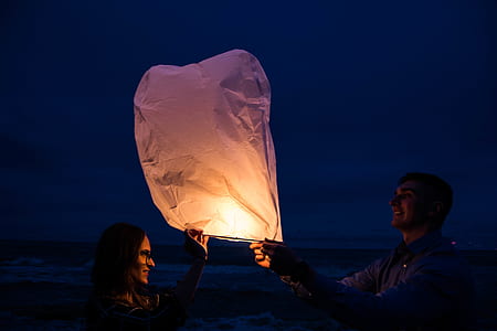 man and woman holds sky lantern thumbnail