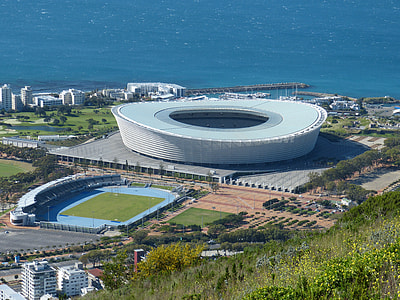 aerial photography of white stadium beside seashore at daytime thumbnail