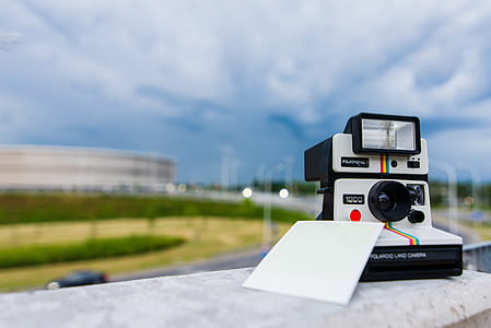 white Polaroid instant camera thumbnail