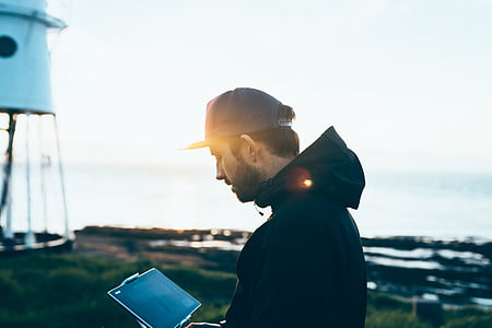 man holding tablet computer thumbnail