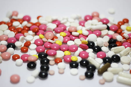 tilt shift photography of assorted-colors tablets thumbnail