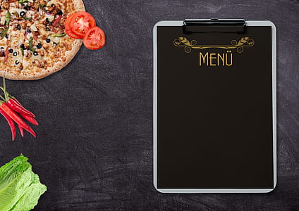 Menu clipboard beside pizza thumbnail
