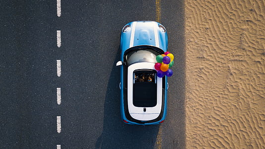Aerial Photography of Blue Car on Road thumbnail