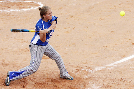 woman playing softball on sands thumbnail