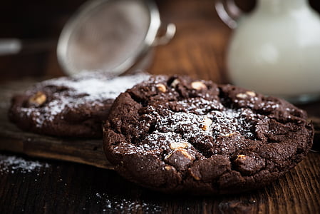 selective focus photography of two chocolate cookies on tabletop thumbnail