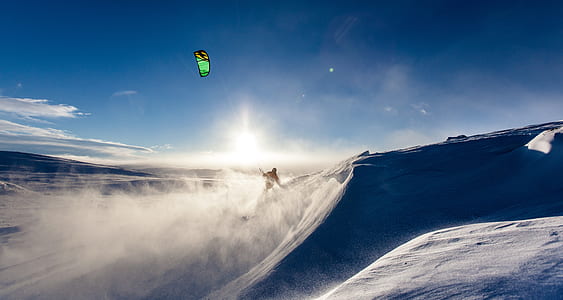 person riding on snow kiting during daytime thumbnail
