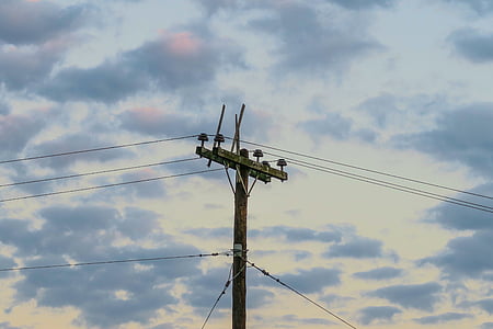 brown electricity power post under blue sky thumbnail